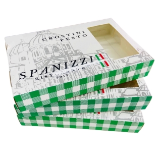 Embalagens abertas da linha refrigerada Spazizzi para crostini pesto, empilhadas com acabamento interno e visor vazado.